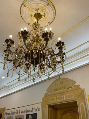 a chandelier hanging from a ceiling in a building at Suite Orientale Maison de L'église du Couvent in Narbonne