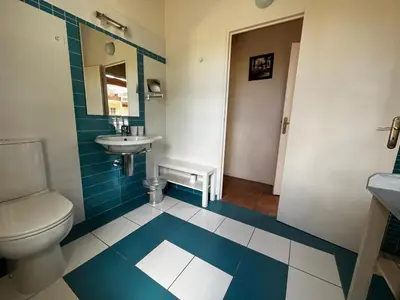 a bathroom with a toilet and a sink at Chambres d'hôtes la Soulenque Luxury B & B in Capestang