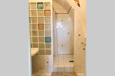 a bathroom with a shower and a sink at Résidence Port Soleil Duplex T3 46 m2 climatisé in Gruissan