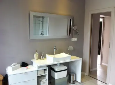 a bathroom with a sink and a mirror on the wall at Villa Zen in Narbonne