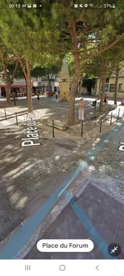 a brick street with an archway in a city at Beau studio en centre ville in Narbonne