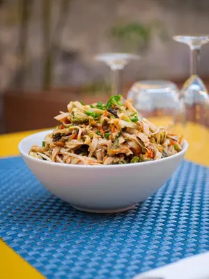 a white bowl of food on a table at COMME A LA MAISON in Espéraza