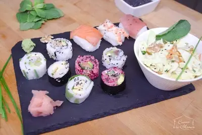 a group of sushi on a table next to a bowl at COMME A LA MAISON in Espéraza