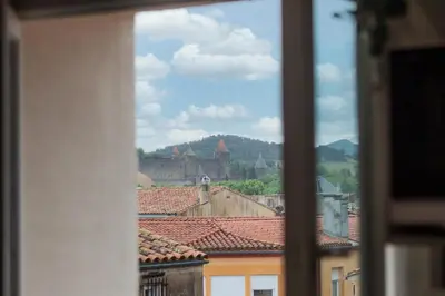 a view from a window of a city with a castle at Le Boheme - Netflix - Wifi - Vue sur la Cité Médiévale et les toits in Carcassonne