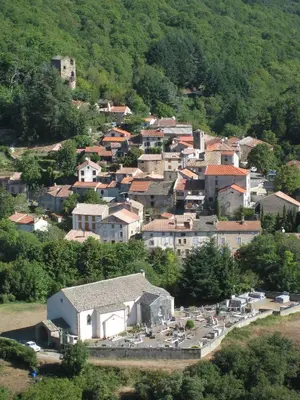 a small town on a hill with houses at Gîte Roc Suzadou in Ferrals-les-Montagnes