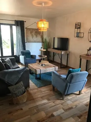 a living room with couches and a tv at MARINA 2 in Narbonne