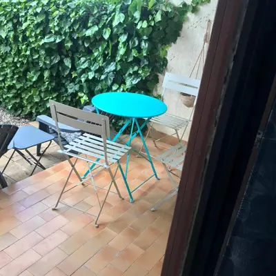 a table and chairs sitting on a patio at MARINA 2 in Narbonne