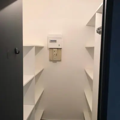 a room with white shelves and a box on the wall at MARINA 2 in Narbonne