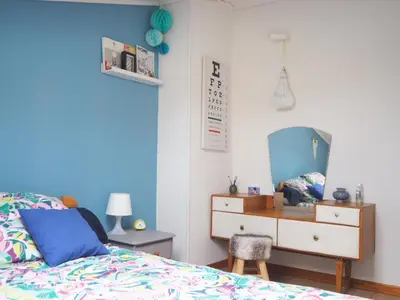 a bedroom with a bed and a dresser and a mirror at Gîte Tanagra : Maison avec piscine et vue exceptionnelle in Roquefort-les-Cascades