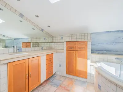a bathroom with a bath tub and a sink and a bath tub at Retreat in Saint Denis in Saint-Denis