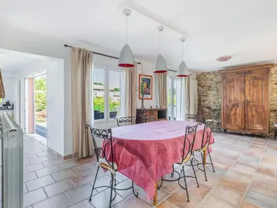 a kitchen and dining room with a table and chairs at Retreat in Saint Denis in Saint-Denis