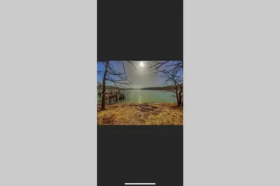 a picture of a picture of a lake with a moon at Le gîte de la vallée du Douctouyre in Dun