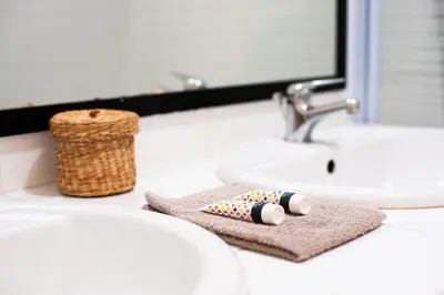a bathroom counter with a sink and a towel at 101 Cour de la Bastide in Carcassonne
