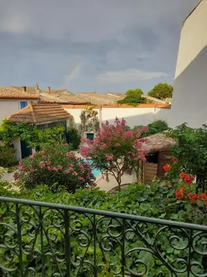 a view from a balcony of a yard with flowers at Villa Saint Léon in Badens