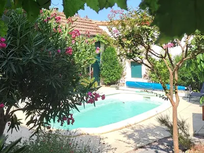 a house with a swimming pool in a yard at Villa Saint Léon in Badens