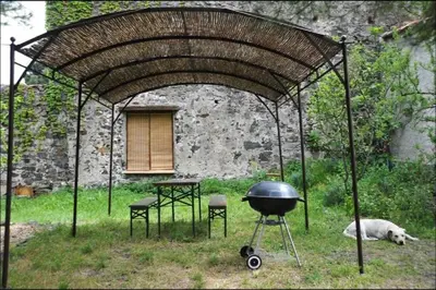 a bathroom with a sink and a wooden door at Charmant Mas tout équipé en pleine nature catalane in Cases-de-Pène