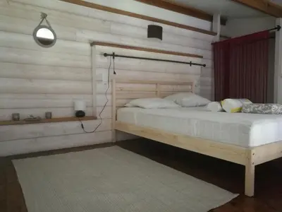 a bed sitting in a room with a staircase at Charmant Mas tout équipé en pleine nature catalane in Cases-de-Pène
