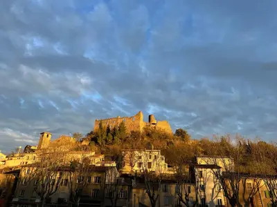 a castle on top of a hill with buildings at Chez Noisette in Durban-Corbières