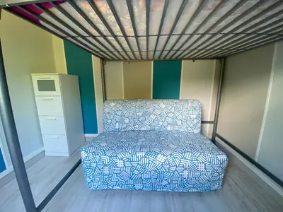 a room with a bed in a small room at RIBES - Chalet Gîte au coeur de la nature in Sournia