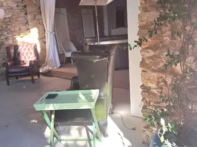 a bathroom with boxes and a toilet with a mirror at Le gîte de Sainte Valière PISCINE,SPA et CLIMATISATION in Sainte-Vallière