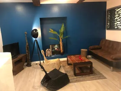 a living room with a couch and a table at Appartement Plein centre in Narbonne
