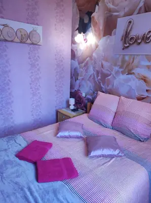 a bedroom with a bed with two towels on it at Chambres d'hôtes Natacha et Franck in Labastide-Rouairoux