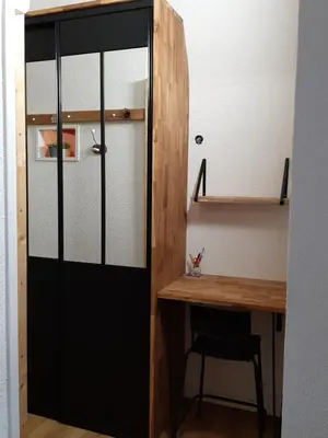 a door leading into a room with a desk at Entre port et village in Gruissan