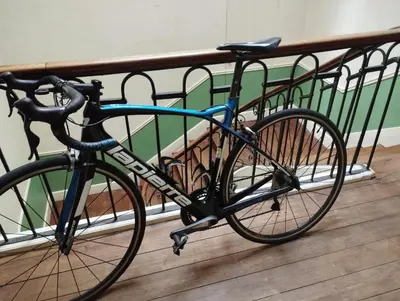 a bike is parked next to a fence at MAISON ALBA LA SOURCE in Mazamet