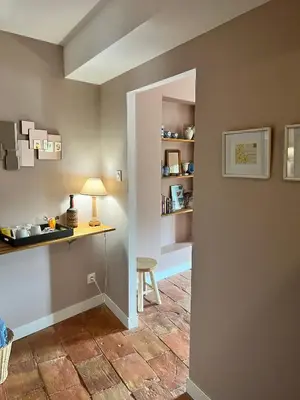 a room with a table and a chair and a desk at Le Domaine de Villespy in Villespy