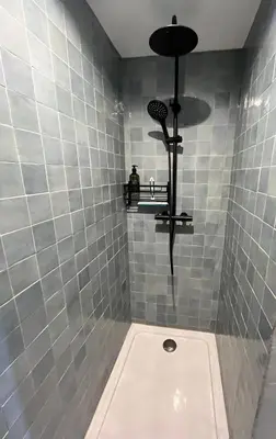 a bathroom with a shower with a toilet and a sink at Le Domaine de Villespy in Villespy