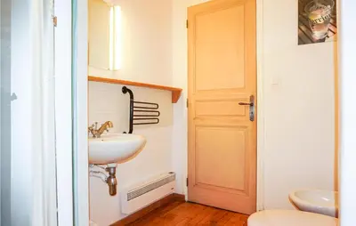 a bathroom with a sink and a toilet at Lovely Home In Siran With Wifi in Siran