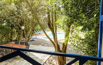 a view of a swimming pool from a balcony at Lovely Home In Siran With Wifi in Siran
