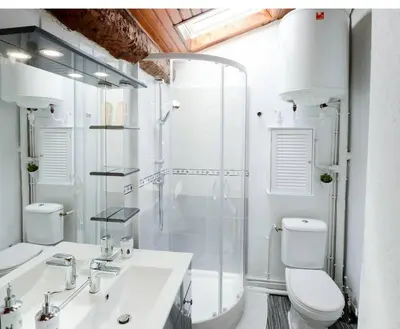 a bathroom with a shower and a toilet and a sink at STUDIO 9 Classé 2 Etoiles in Carcassonne