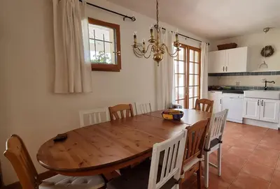 a living room with a couch and a table at Le Bariole, luxury villa with heated pool in Cesseras