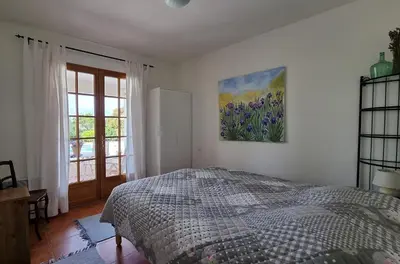 a living room with a couch and a table at Le Bariole, luxury villa with heated pool in Cesseras