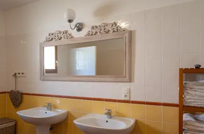 a bedroom with a bed with a quilt on it at Le Bariole, luxury villa with heated pool in Cesseras