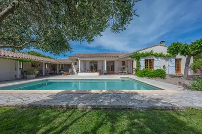 a house with a swimming pool in a yard at Le Bariole, luxury villa with heated pool in Cesseras