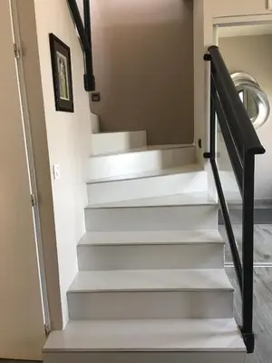 a stairwell in a house with white stairs at Blue Diamond Room in Salles-dʼAude