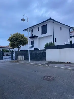 a white house on the side of a street at Blue Diamond Room in Salles-dʼAude