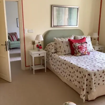 a bedroom with a bed and a window at Mille Fleurs in Castres