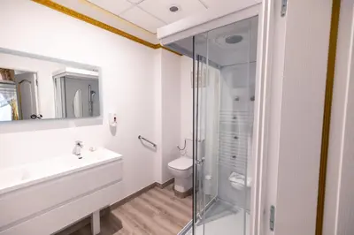 a bathroom with a shower and a sink and a toilet at Chambre a Baldaquin Maison de L'Église Du couvent in Narbonne