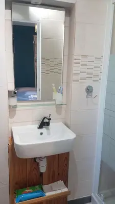a bathroom with a sink and a mirror at Libre à vous ... in Félines-Termenès