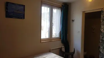 a bedroom with a bed and a window at Libre à vous ... in Félines-Termenès