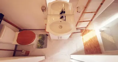 a small bathroom with a toilet and a sink at Libre à vous ... in Félines-Termenès