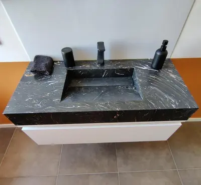 a black counter top with plastic on it at LE CELESTHYM - SPA Privatif in Conques-sur-Orbiel