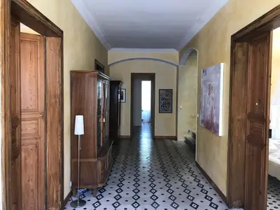 a hallway with a room with a bed and a hallwayngthngthngthngthngth at Maison La vie est belle in Luc-sur-Orbieu