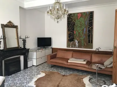 a living room with a couch and a fireplace at Maison La vie est belle in Luc-sur-Orbieu