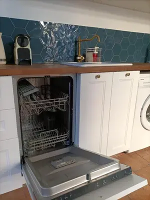 an oven with a dish rack in it in a kitchen at La Dolce Vita in Carcassonne