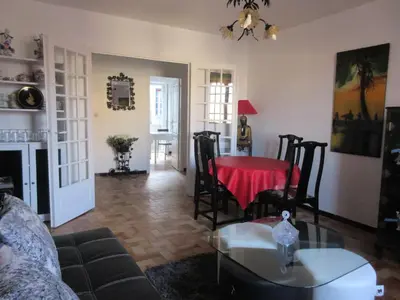 a living room with a table and a couch at Appartement Cité de Carcassonne in Carcassonne