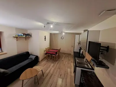 a living room with a couch and a table at Gîte La Dolce Vita in Saint-Félix-Lauragais